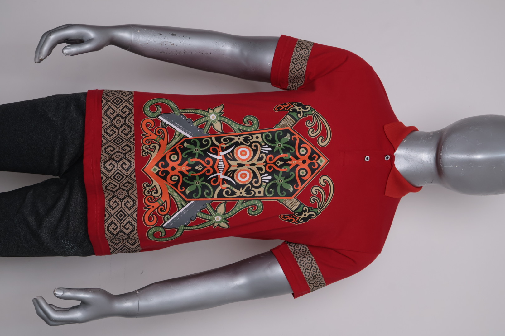 Polo Dayak Talawang Mandau Abdul Combed 24s Merah Cabe (Pendek)